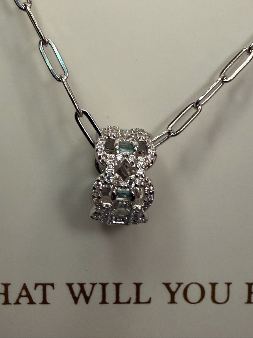 .925 Sterling Silver with Rhodium plating. Lab created Paraiba Tourmaline